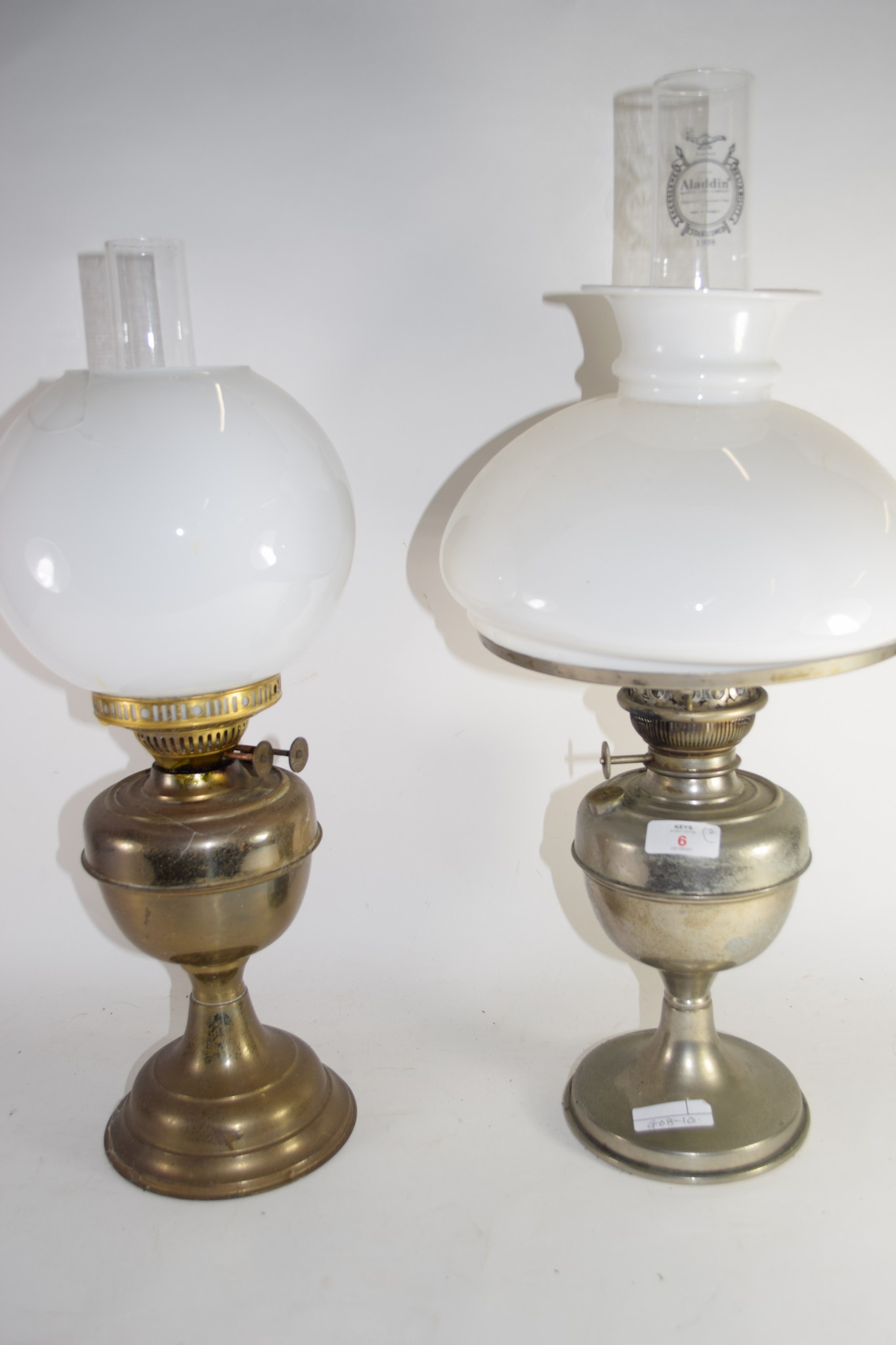 TWO METAL LAMPS WITH GLASS OPAQUE SHADES AND CHIMNEYS