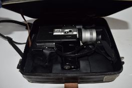 CASE CONTAINING AN OLD MOVIE CAMERA