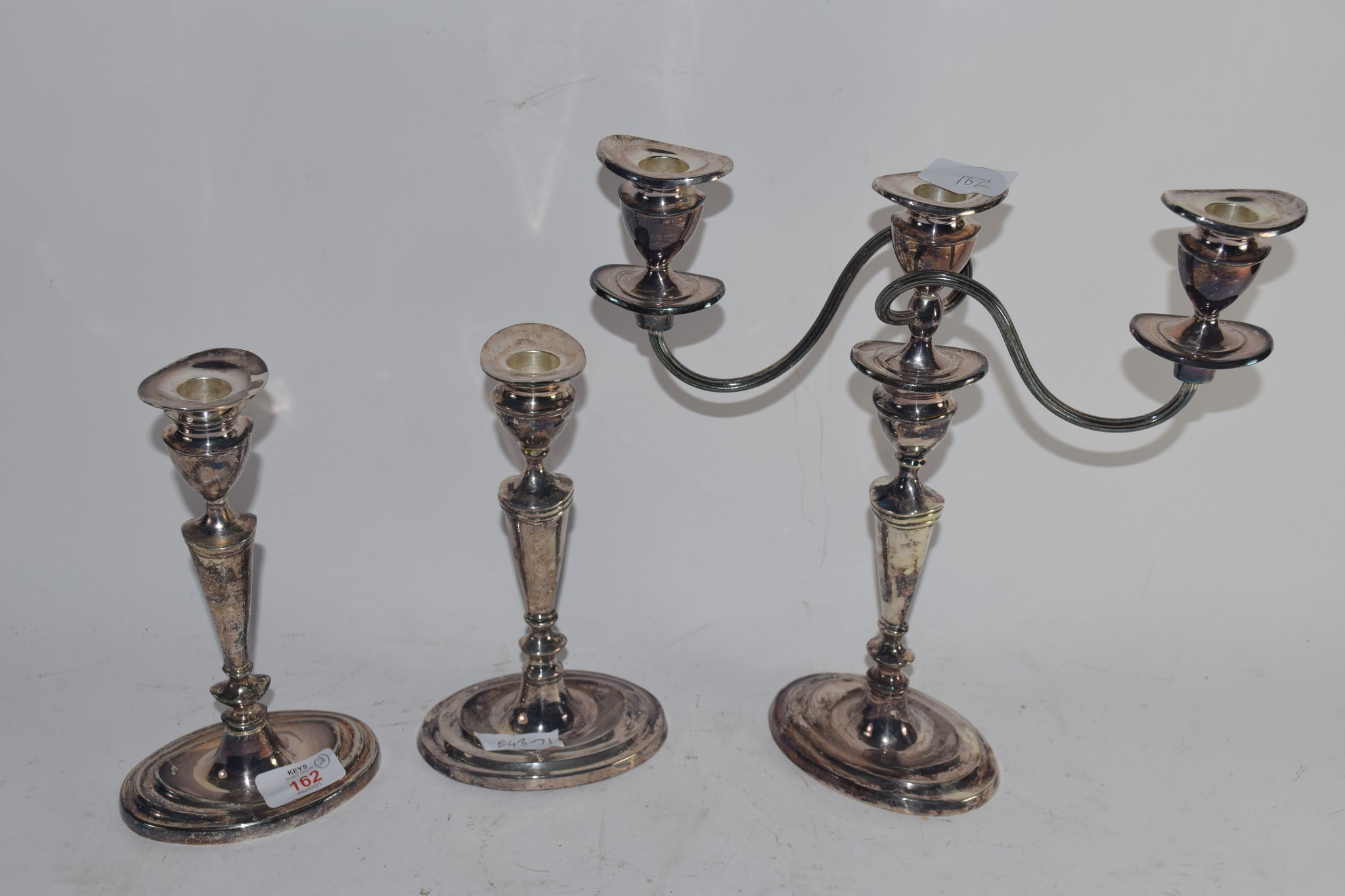 PAIR OF PLATED CANDLESTICKS AND FURTHER PLATED CANDELABRA