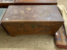 ORIENTAL WOODEN STORAGE CHEST WITH CARVED FIGURES OF CHARACTERS AND JUNKS, LENGTH APPROX 93CM