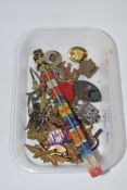 SMALL PLASTIC TRAY CONTAINING ENAMEL BADGES