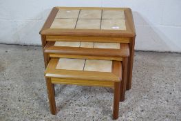 NEST OF THREE TILE TOPPED LOW TABLES, LARGEST APPROX 57CM X 40CM