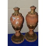 TWO TERRACOTTA LAMP BASES MODELLED IN CLASSICAL STYLE