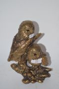 TWO GILT COLOURED OWLS ON BRANCH