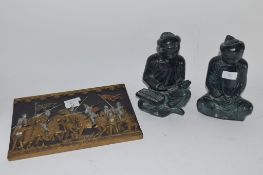 METAL PLAQUE MODELLED WITH A MEDIEVAL TOURNAMENT SCENE, TOGETHER WITH TWO STONE ORIENTAL FIGURES