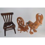 MODEL OF A CHAIR WITH A WOODEN SPINNING WHEEL AND A MODEL OF A DUCK