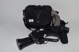 CLOTH CASE CONTAINING A PANASONIC CAMERA WITH LUMIX ZOOM LENS