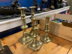 TWO PAIRS OF BRASS CANDLESTICKS