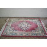 CUT WOOL RUG FEATURING FLORAL DECORATION ON A MOSTLY PINK GROUND, APPROX 203 X 122CM