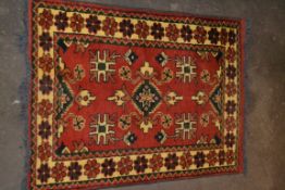 SMALL RUG MAINLY RED GROUND AND CREAM BORDER