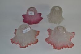 FOUR MINIATURE GLASS SHADES, PINK AND CLEAR