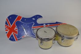 MODERN NOVELTY PLASTIC CLOCK GUITAR TOGETHER WITH BONGOS