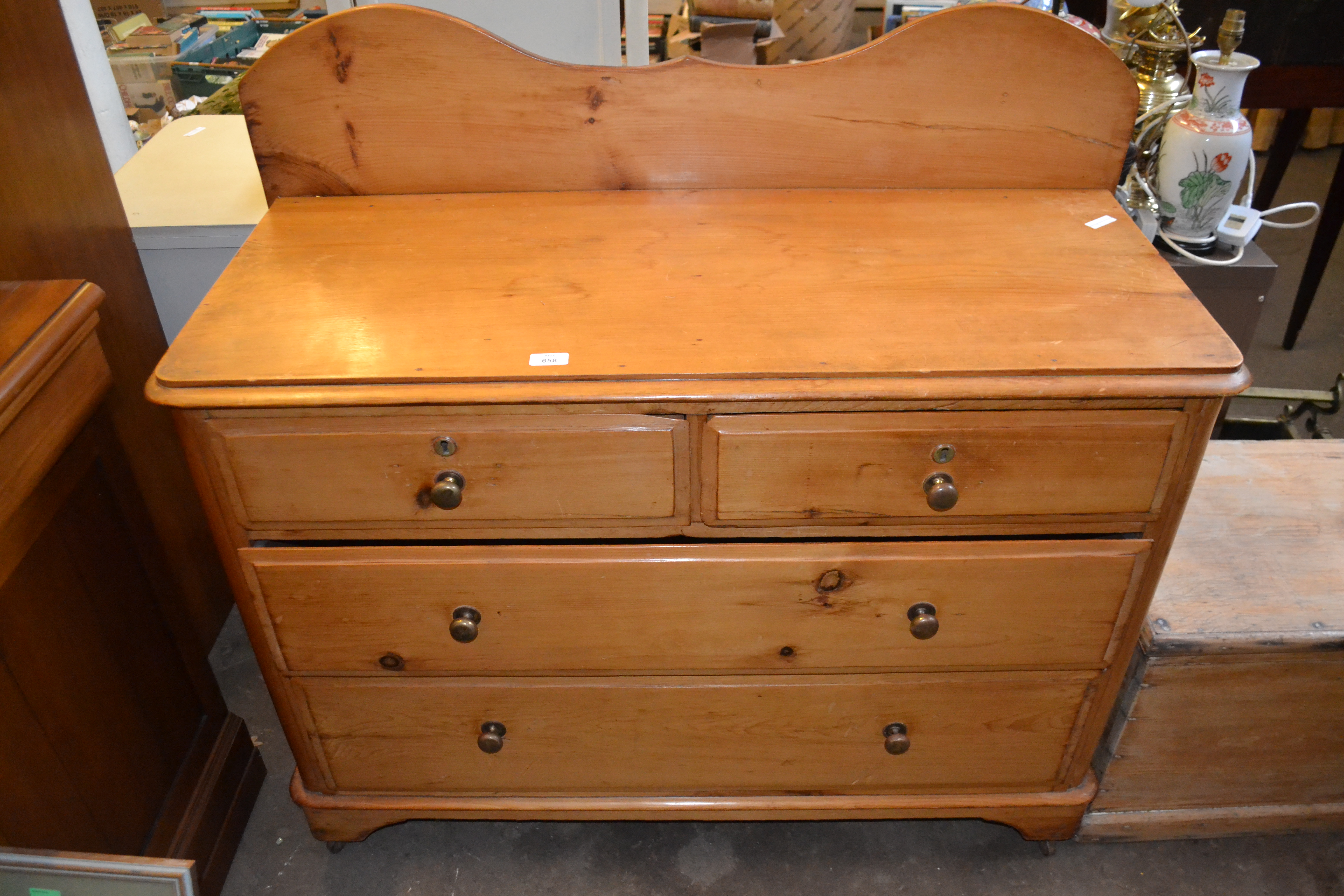 20TH CENTURY PINE TWO OVER TWO DRAWER CHEST WITH BRASS HANDLES AND CURVED FINIAL, 112CM WIDE