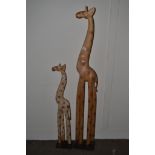 TWO MODERN FREE STANDING WOODEN MODELS OF GIRAFFES, TALLEST 151CM