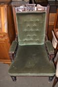 LATE 19TH/EARLY 20TH CENTURY GREEN UPHOLSTERED CHAIR ON METAL CASTERS