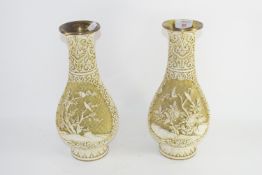 TWO ORIENTAL VASES WITH A RELIEF DESIGN OF BIRDS ON BRANCHES ON METAL