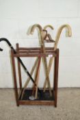VINTAGE STICK STAND TOGETHER WITH AN ASSORTMENT OF STICKS AND SHOOTING STICK