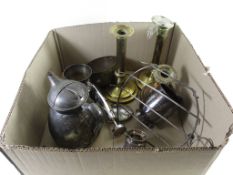 BOX CONTAINING TWO BRASS CANDLESTICKS, PLATED JUG AND COVER, PLATED MUGS