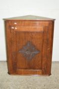 OAK CORNER WALL CUPBOARD WITH CARVED DECORATION, APPROX WIDTH 70CM MAX