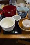 CERAMIC ITEMS INCLUDING LARGE RED COLOURED JARDINIERE, WHITE COLOURED JARDINIERE WITH RELIEF MOULDED