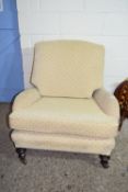 19TH CENTURY MAHOGANY FRAMED UPHOLSTERED EASY CHAIR, RAISED ON TURNED LEGS OVER BRASS CASTERS, WIDTH