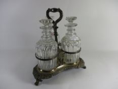 PLATED CONDIMENT HOLDER RAISED ON THREE LION PAW FEET, NOW CONTAINING THREE CUT GLASS DECANTERS