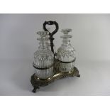 PLATED CONDIMENT HOLDER RAISED ON THREE LION PAW FEET, NOW CONTAINING THREE CUT GLASS DECANTERS