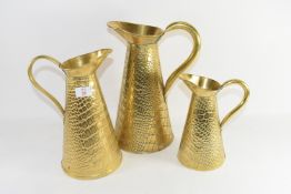 THREE BRASS JUGS