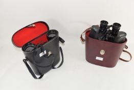 TWO BINOCULARS IN LEATHER CASES, ONE MADE BY UNIVERSAL 7X50 MAGNIFICATION, THE OTHER BY CONCORD WITH