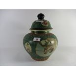 ORIENTAL JAR AND COVER, GREEN GROUND DECORATED WITH ORIENTAL FIGURES