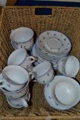 BASKET CONTAINING PART POLISH CERAMIC TEA SET WITH WHITE AND FLORAL DESIGN