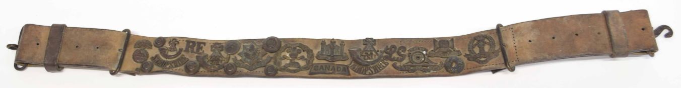 Great War British "Hate belt" with quantity of cap badges on belt to include King Skillings Light