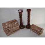 PAIR OF WOODEN CANDLESTICKS, TOGETHER WITH A WOODEN TRUNK