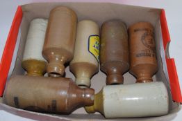 BOX CONTAINING STONE GINGER BEER BOTTLES, SOME BY STUART & PATTERSON, NORWICH & SWAFFHAM