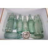 BOX CONTAINING GREEN GLAZED LEMONADE BOTTLES