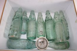 BOX CONTAINING GREEN GLAZED LEMONADE BOTTLES