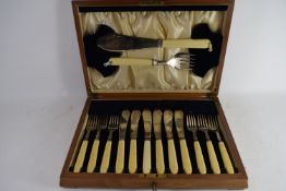 BOX CONTAINING BONE HANDLED FISH KNIVES AND FORKS