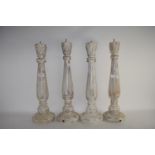 FOUR WHITE GLAZED WOODEN CANDLEHOLDERS