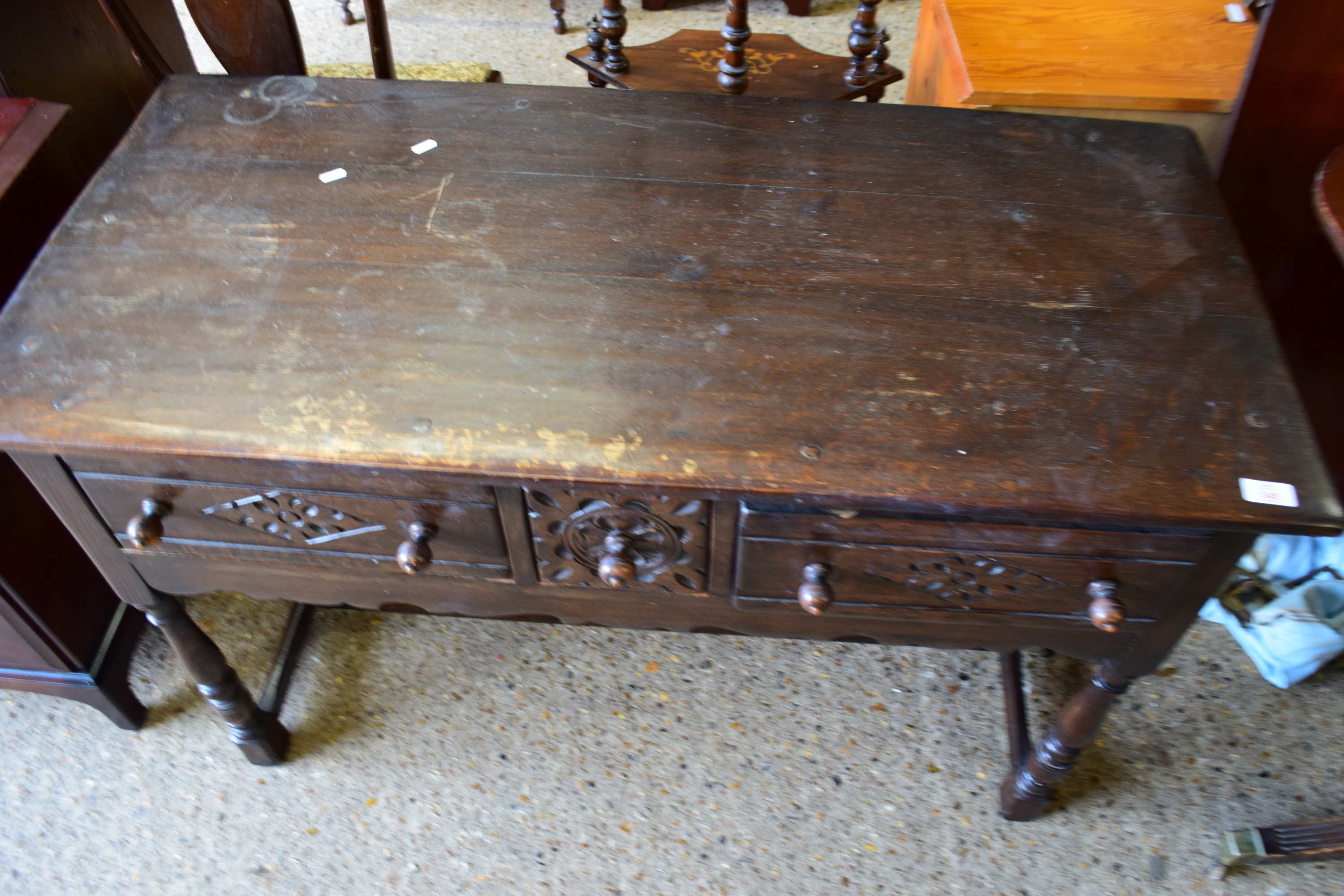 DARK WOOD LOW DRESSER IN THE ARTS AND CRAFTS STYLE, RAISED ON TURNED JOINTED LEGS, THREE CARVED - Image 2 of 2