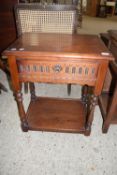 DARK WOOD REPRODUCTION SIDE TABLE WITH DRAWER BENEATH WITH CARVED DECORATION, APPROX 61CM WIDE