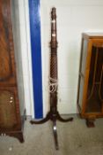 HEAVILY CARVED STAINED WOOD LAMP STANDARD RAISED ON TRIPOD LEGS, HEIGHT APPROX 160CM