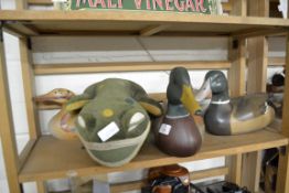THREE POTTERY DUCKS AND A MODEL OF A FROG