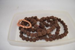 SMALL TRAY CONTAINING BEADS