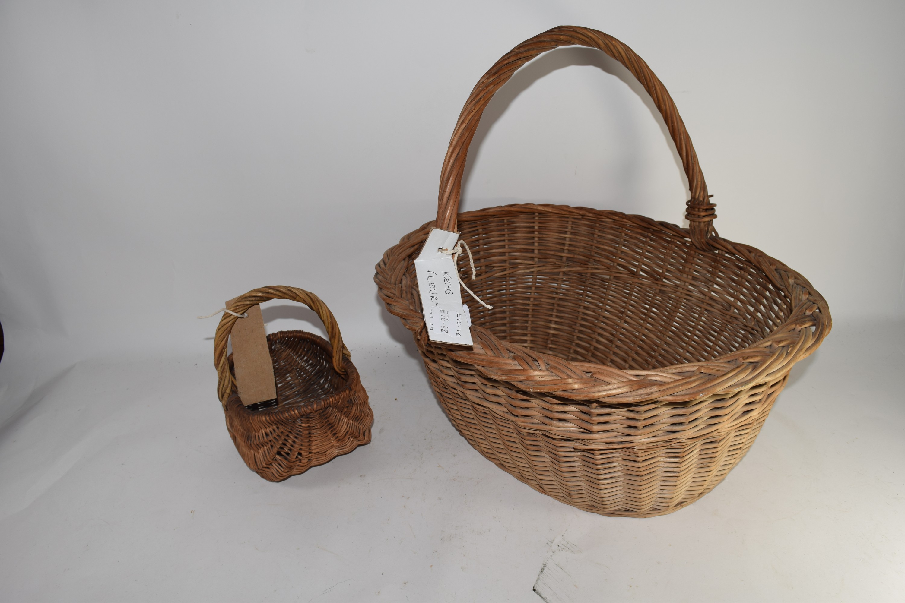 TWO WICKER WORK BASKETS