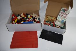 TWO BOXES CONTAINING LEGO ITEMS FROM THE 1950S AND 1970S, TOGETHER WITH CIGARETTE CARDS ETC