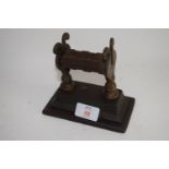 LATE 19TH CENTURY KNIFE SHARPENER ON PEDESTAL METAL BASE