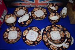 TEA SET IN AN IMARI DESIGN BY ROYAL ALBERT COMPRISING CUPS, SAUCERS, MILK JUG, DERBY STYLE MILK JUG,