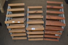 THREE VARIOUS WOODEN AND METAL WINE RACKS, LARGEST 42CM WIDE