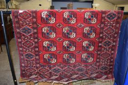 RUG WITH GEOMETRIC DESIGNS SURROUNDING A CENTRAL PANEL, APPROX 132CM X 180CM