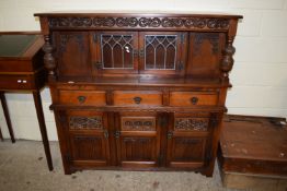 REPRODUCTION COURT CUPBOARD WITH CARVED DECORATION, LENGTH APPROX 138CM MAX